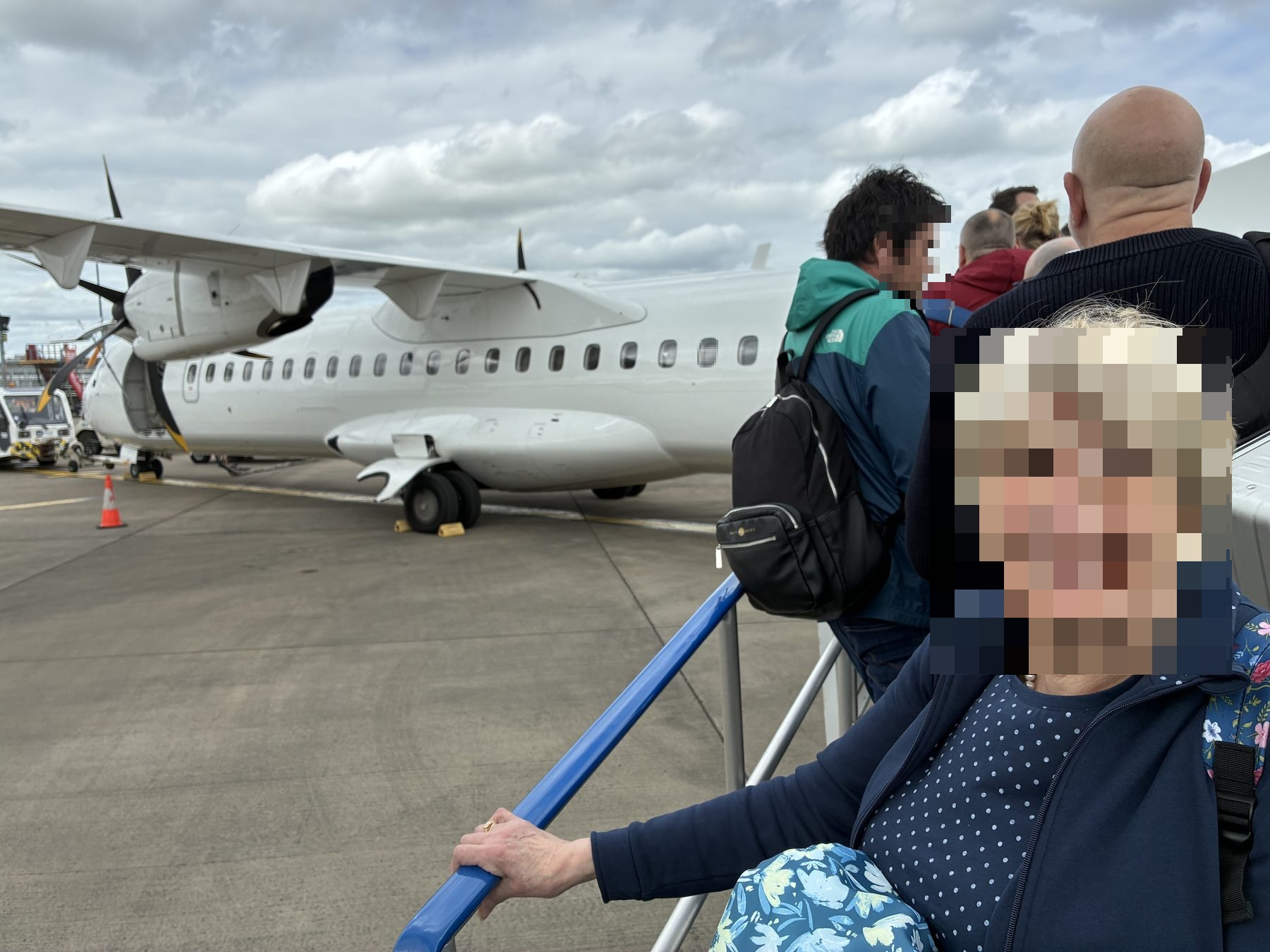 Mum boarding the propeller plane at Edinburgh