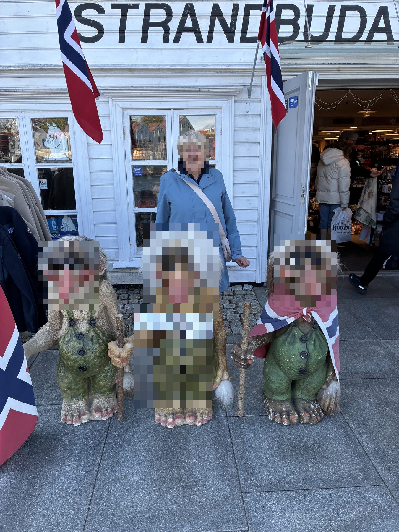 Mum posing with three trolls