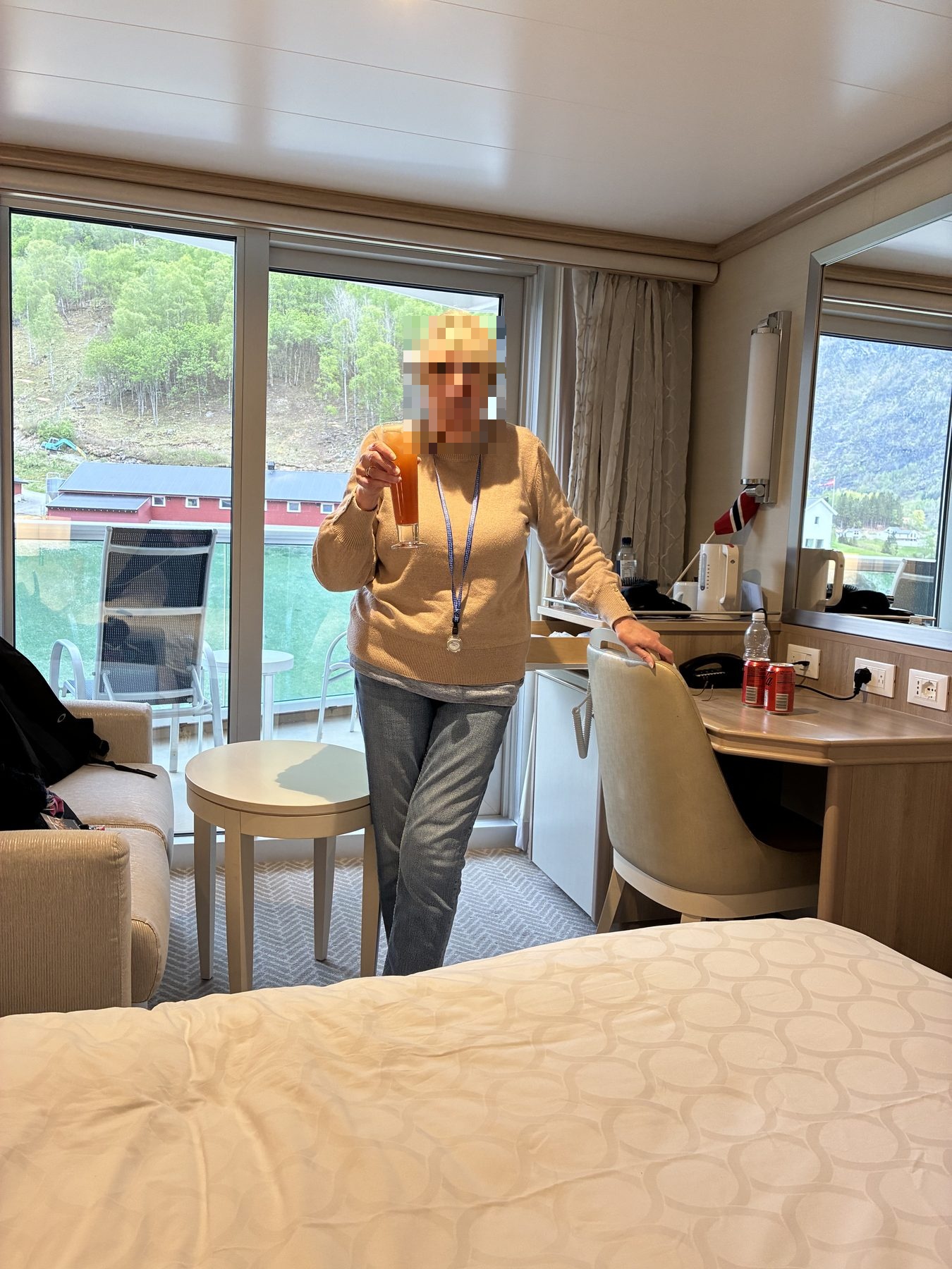 Mum with cocktail in the cabin