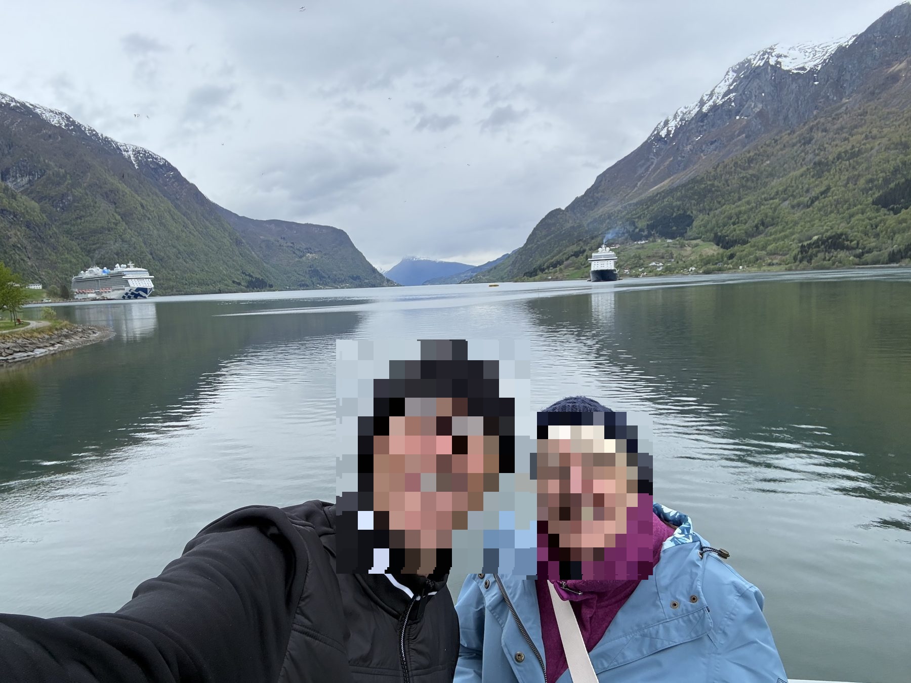 Mum by the fjord with two cruise ships